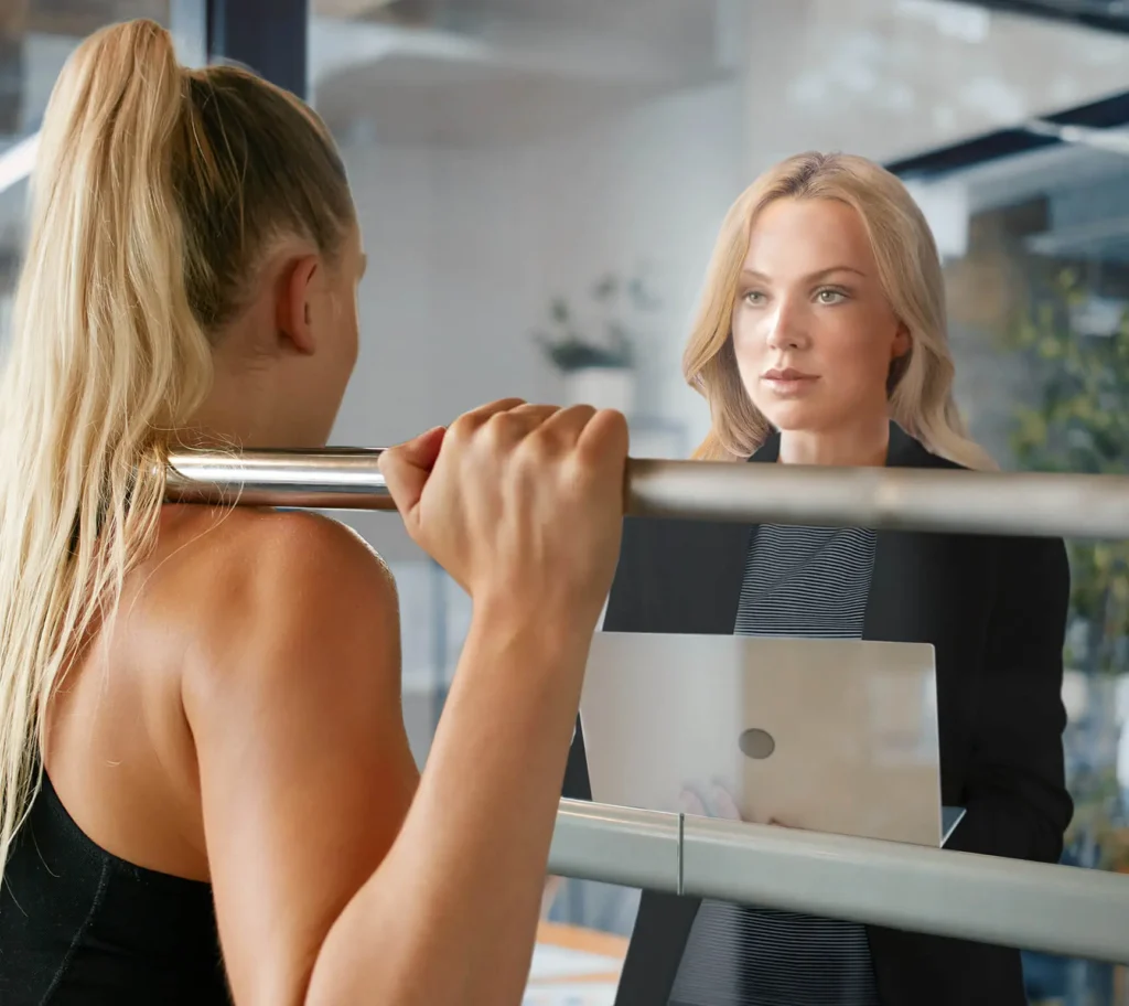 Woman looking at a mirror: represents executive leadership training